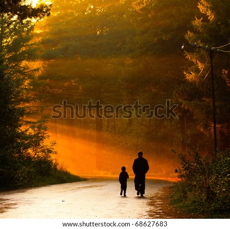 father and son walking. stock photo : father and son