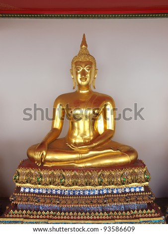 sitting golden budda in temple in thailand