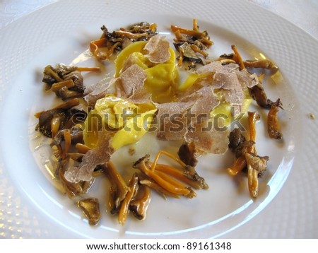 capon stuffed tortellini whit mushrooms and white truffle. italian cuisine