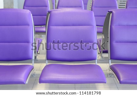 a row of purple chair