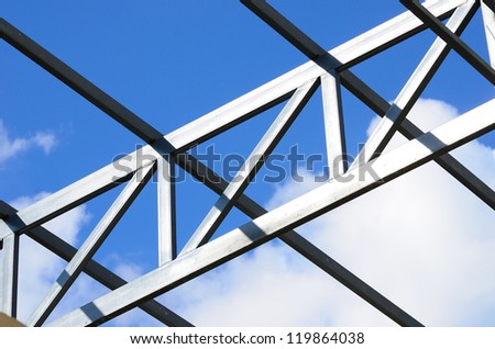 Steel frame of the factory roof in construction.