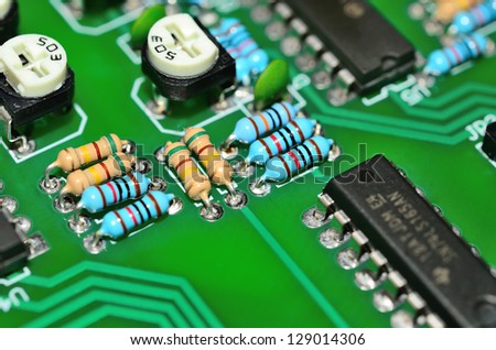 Detail of an electronic printed circuit board with many electrical components
