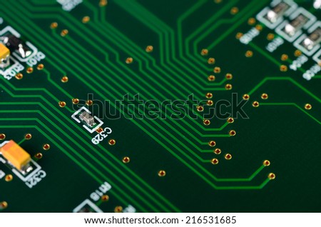 Detail of an electronic printed circuit board with many electrical components