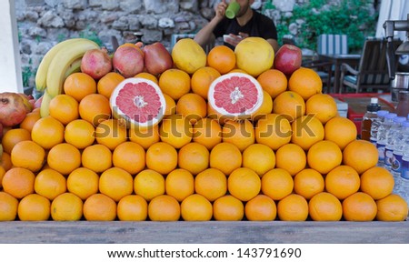 Fruit Stall with Oranges, Red Apples, Grapefruits, Bananas and Pomegranates