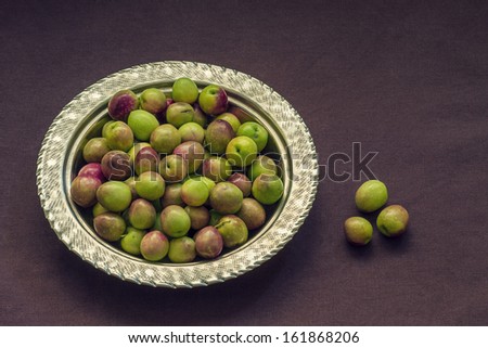 Raw Green Olives in a Silver Bowl
