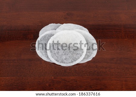 Round Tea Bags on a Brown Table