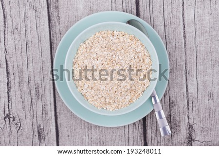 A Bowl of Oats on a Rustic Table