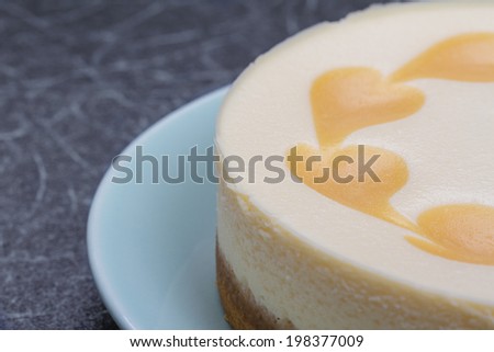 Close up Image of a Whole Cheesecake with Heart Patterns on.Copy Space