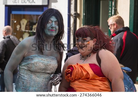 WHITBY, ENGLAND - April 25, 2015: People Celebrating the Famous Goth Weekend in the Street. Whitby Goth Weekend is a Twice-Yearly Music Festival for Goths, in Whitby, North Yorkshire, England