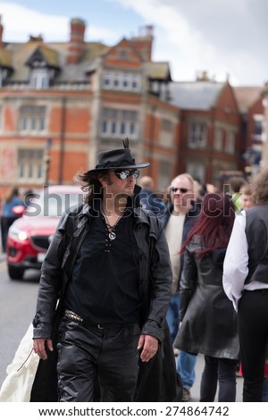WHITBY, ENGLAND - April 25, 2015: A Man in Gothic Attire Participating at Whitby Goth Weekend. Whitby Goth Weekend is a Twice-Yearly Music Festival for Goths, in Whitby, North Yorkshire, England
