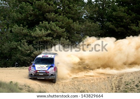 CORINTHIA, GREECE - JUN 1: Norwegian driver Mads Ostberg and his codriver Jonas Andersson in a Ford Fiesta RS WRC race in the 59th Acropolis Rally of Greece, on Jun 1, 2013 in Loutraki, Greece.