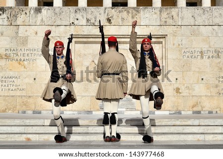 ATHENS, GREECE - MAY 30: Evzones changing the guard at the Tomb of the Unknown Soldier in front of the Greek Parliament Building at Syntagma Square on May 30, 2013 in Athens,Greece.