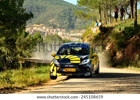 SALOU, SAPIN - OCT 25: Dutch driver Timo Van Der Marel and his codriver Rebecca Smart in a Ford Fiesta R2 race in the 50th Rally RACC Rally of Spain, on Oct 25, 2014 in Salou, Spain.