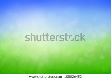 Blue and green blurry background with rays and flares