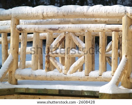 snow on a wooden bridge