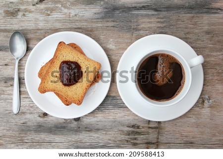 Morning coffee Toast with marmalade and coffee on wooden table