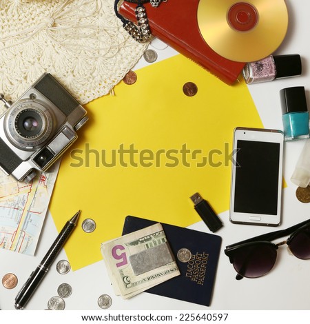 Leisure activity, Yellow paper surrounded with everyday items - planning and organization concept. Add own text.