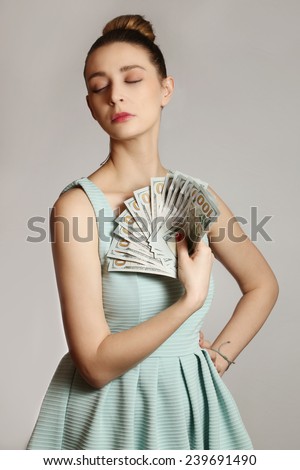 Woman with money, Fashion portrait of young woman with bunch of dollar bills