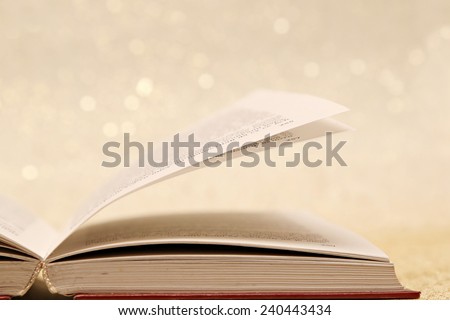 Open book, Open book on the sparkly vintage golden background