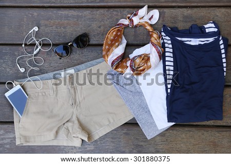 Woman\'s basic summer fashion  - chino shorts with three cotton t shirts