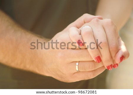 Happy couple  Close-up photo of a caucasian couple\'s hands on their wedding day.