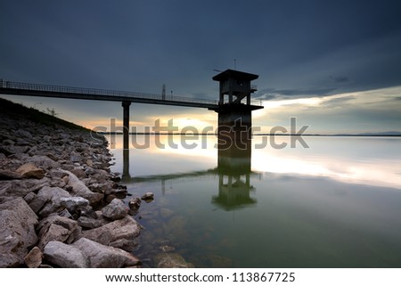 Tower in the reservoir at sunset in the east, Thailand