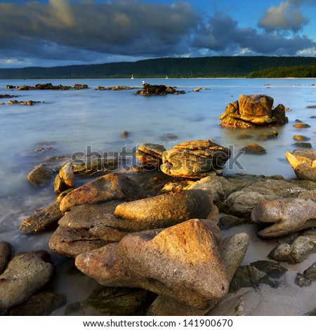 Summer of rocks in the sea at evening light, The natural landscape