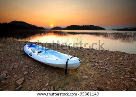 Canoe Kayaks at waters edge on Lake Kaeng Krachan Dam, Thailand