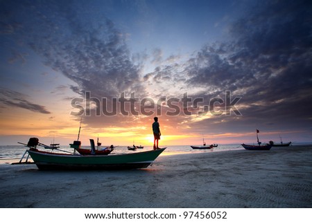Standing on a fishing boat at sunset in eastern Thailand