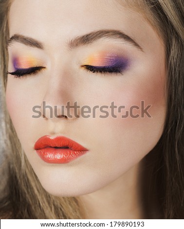 Beauty Model Woman .Healthy Hair and Beautiful Professional Makeup. Red Lips and rainbow Make up. Gorgeous Glamour Lady Portrait. Haircare, Skincare concept