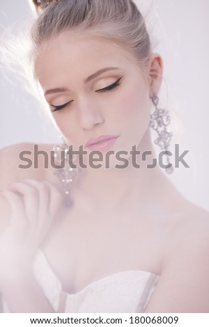 Portrait of beautiful bride. Wedding dress. Wedding decoration. Creative Make up and Hair Style. Hairstyle.