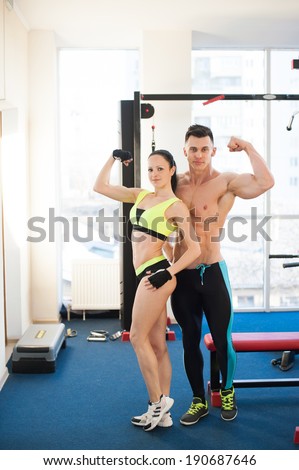 Fit couple at the gym looking very attractive. bodybilding and fitness model. sexy, power  and beautiful
