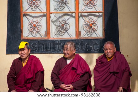 SHIMLA - DECEMBER 06: Tibetan monks resting and chatting on December 06, 2009 at Jonang Monastery in Shimla, India. About 120,000 Tibetan refugees are in India nowadays since first settling in 1959.