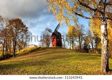 Old windmill during autumn in Soderkoping, Sweden