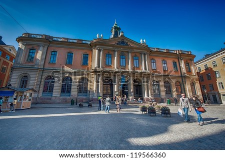 STOCKHOLM, SWEDEN - APRIL 30:Tourists admire the Stockholm stock exchange building on April 30, 2009 in Stockholm. The building in the Old Town is the home of the Swedish academy and the Nobel museum.