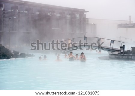 BLUE LAGOON, ICELAND - JUNE 16: Tourists enjoying the famous Blue Lagoon on June 16, 2010 in Iceland. This geothermal spa is one of the most visited attractions in Iceland.