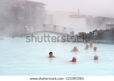 BLUE LAGOON, ICELAND - JUNE 16: Tourists relaxing in the famous Blue Lagoon on June 16, 2010 in Iceland. This geothermal spa is one of the most visited attractions in Iceland.