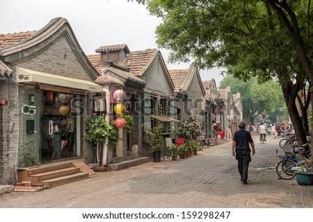 BEIJING CHINA JUNE19 The main street in the Jingyang Hutong on June 19 2012 in Beijing The Hutongs are popular among tourists as they provide a glimpse of life in Beijing centuries ago BEIJING CHINA JUNE19 The main street in the Jingyang Hutong on June 19 2012 in Beijing The Hutongs are popular among tourists as they provide a glimpse of life in Beijing centuries ago