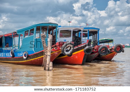 VINH LONG, VIETNAM - MARCH 6: Traditional colorful river boats on March 6, 2009 in Vinh Long. The Mekong river is a major route for transportation in Southeast Asia.