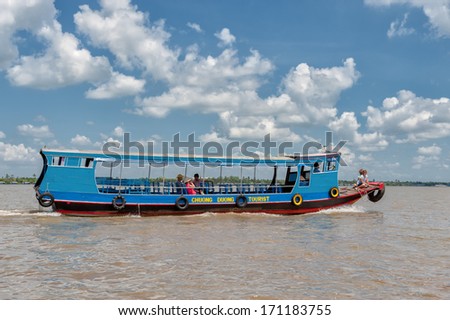 VINH LONG, VIETNAM - MARCH 6: Traditional colorful river boat on March 6, 2009 in Vinh Long. The Mekong river is a major route for transportation in Southeast Asia.