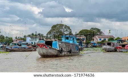 VINH LONG, VIETNAM - MARCH 7: Traditional riverboats moored at Mekong river on March 7, 2009 near Vinh Long. The Mekong river is a major route for transportation in Southeast Asia.