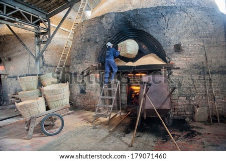VINH LONG, VIETNAM - MARCH 7: Rice straw fuels a brickworks in the Mekong delta on March 7, 2009 near Vinh Long. The Mekong delta has become popular among tourists wishing to experience rural Vietnam.