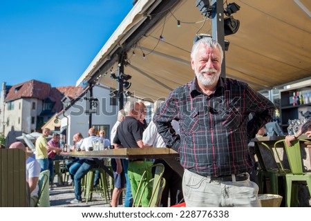VISBY, SWEDEN -JUNE 10: Bjorn Hellberg poses after recording a TV show on June 10, 2014 in medieval Visby. Bjorn Hellberg is a popular TV personality and a successful author of criminal novels.