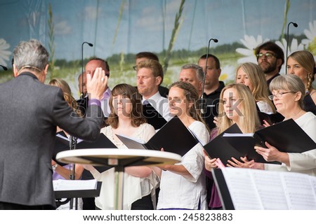 NORRKOPING, SWEDEN - JUNE 6: The Bel Canto choir entertains during National day celebrations on June 6, 2014 in Norrkoping. The national day of Sweden is an official holiday.