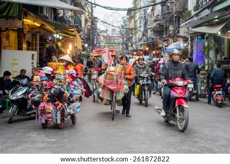 HANOI, VIETNAM   FEBRUARY 11: Busy traffic in the old quarter on February 11, 2015 in Hanoi. There are approximately four million motorbikes on the streets of Hanoi.