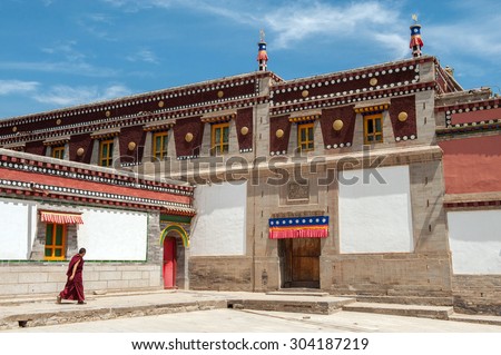 QINGHAI PROVINCE, CHINA â?? JUNE 25: Tibetan monk at Kumbum Monastery on June 25, 2012 in Qinghai Province. This Tibetan Buddhist monastery founded in 1583 ranks second only to Lhasa in importance.