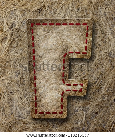 Mulberry Paper Alphabet (F) on brown paper background.