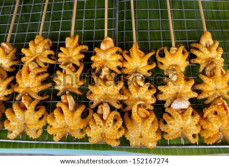 Grilled Squid, Thailand Food - Barbecue from squids sold on the water market.