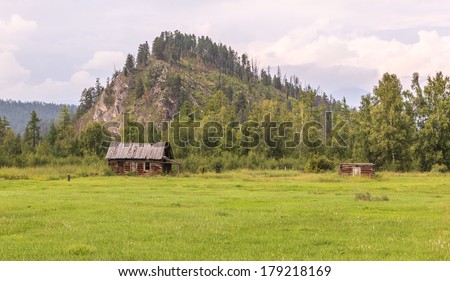 The destroyed house in a mountain valley. A landscape