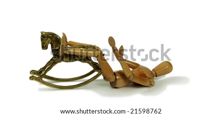 Brass rocking horse represent childhood with Wooden model representing a person laying down